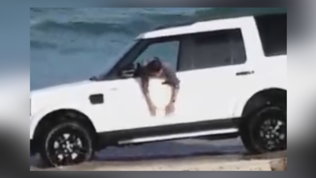 SUV sinks in New Jersey beach as owner tries to save it - VIDEO