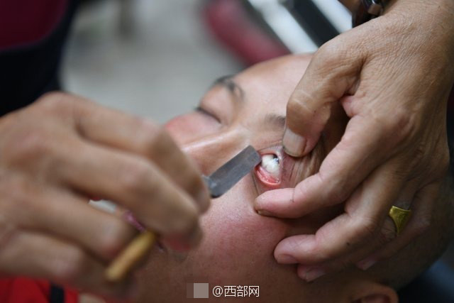 An Eyeball Shaving Barber